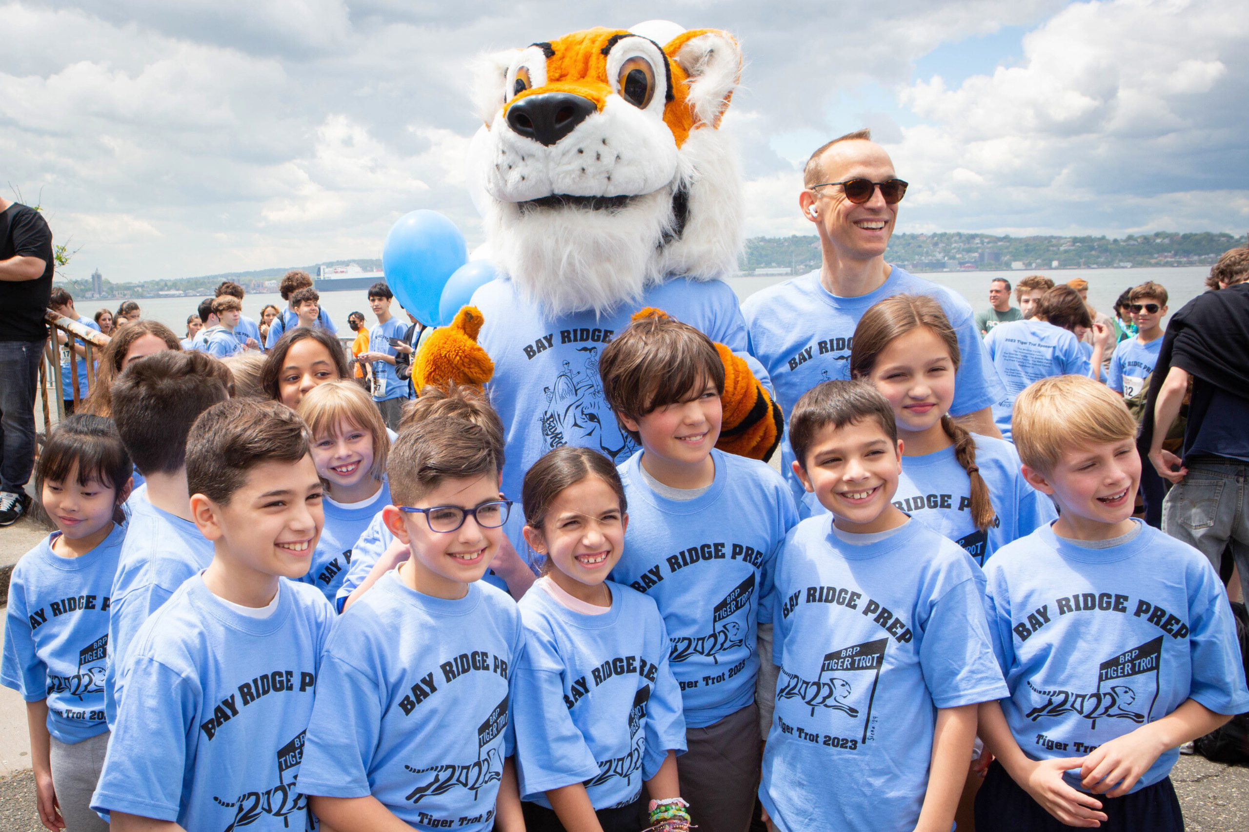 Students and school mascot, Ty the Tiger, and Head of School